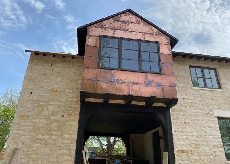 Copper metal panel facade on a stone building for Metal Roof Coating in Fountain Valley
